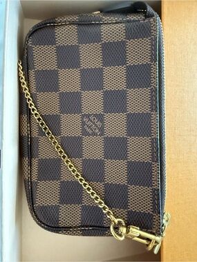 Louis Vuitton Damier Ebene mini pochette in Brown